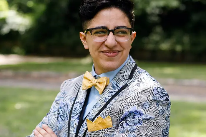 A photo of Sander Saba, wearing glasses and a suit. Saba is suing the Governor Andrew Cuomo and the New York State Department of Motor Vehicles for not including an "X" gender option in New York drivers licenses.